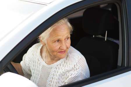 Elderly woman driving carの写真素材
