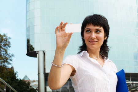 Happy business woman with card の写真素材