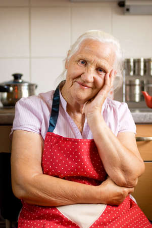 Smiling senior woman in the kitchenの写真素材