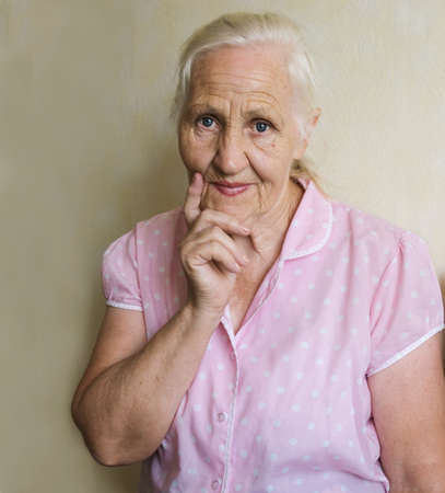 Thoughtful elderly womanの写真素材