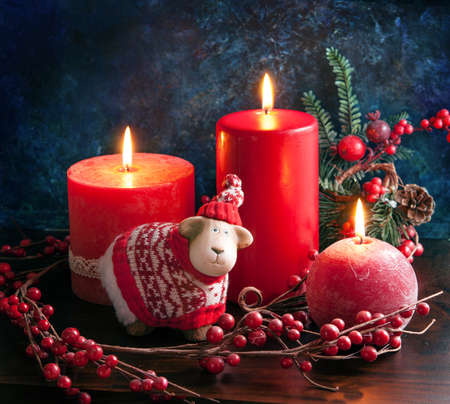 New year card with a candle and a  sheep, a symbol of 2015, background with space for textの写真素材