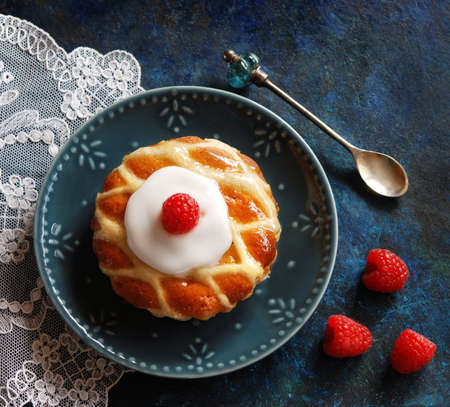 Almond cake with icing and raspberries, frangipane tartの写真素材