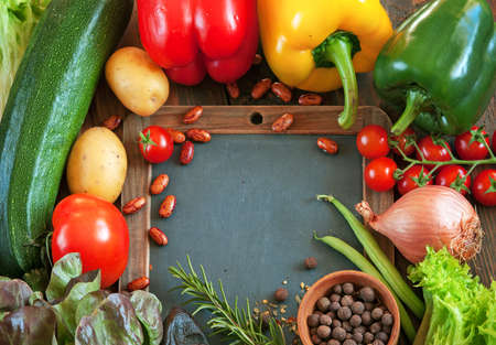 Food vegetables background with black desk for notesの写真素材