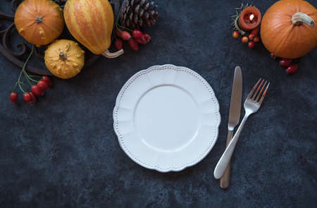 Thanksgiving table setting, autumn decor with pumpkinsの写真素材