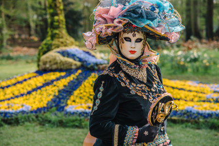 BRUSSELS, BELGIUM - April 15, 2018: Venetian parade in Groot-Bijgaarden Castle in springtime, Floralia Brussels. Portrait in venetian costumes and maskのeditorial素材