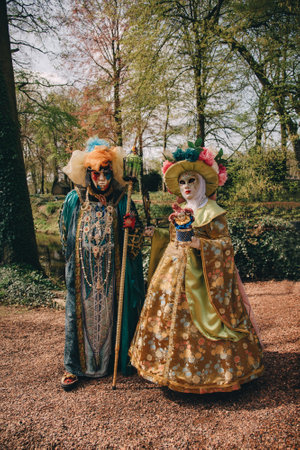 BRUSSELS, BELGIUM - April 15, 2018: Venetian parade in Groot-Bijgaarden Castle in springtime, Floralia Brussels. Portrait in venetian costumes and maskのeditorial素材