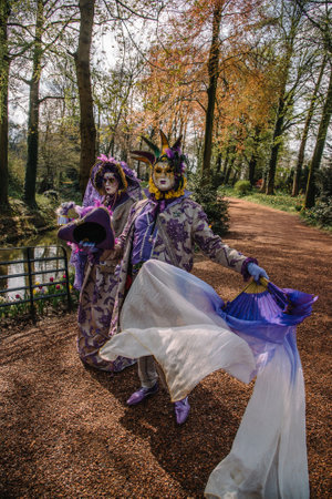 BRUSSELS, BELGIUM - April 15, 2018: Venetian parade in Groot-Bijgaarden Castle in springtime, Floralia Brussels. Portrait in venetian costumes and maskのeditorial素材