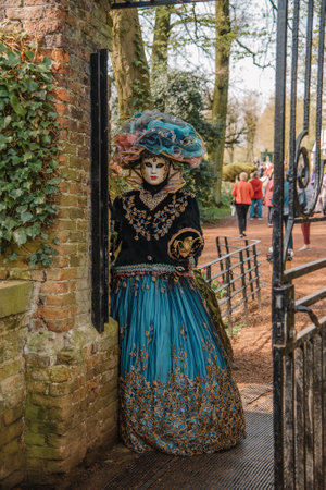 BRUSSELS, BELGIUM - April 15, 2018: Venetian parade in Groot-Bijgaarden Castle in springtime, Floralia Brussels. Portrait in venetian costumes and maskのeditorial素材