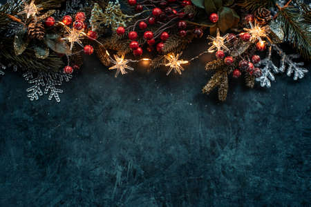 Christmas background with a festive decor, fir tree and place for textの写真素材