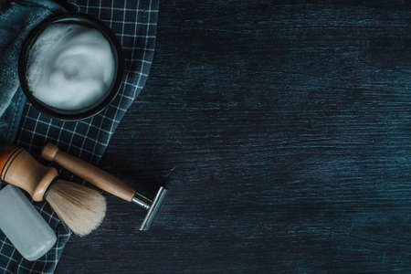Barber tools on a black background. Shaving foam with razor, shaving brush and White crystal alum stone or Potassium alumの写真素材