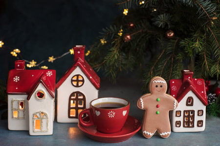 Christmas decorations and gingerbread men cookie with cup of coffeeの写真素材