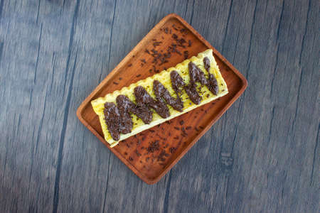 Top view of toast with delicious chocolate sprinkles. Served on wooden trays.の写真素材