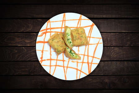 Egg martabak, Indonesian street food wrapped and fried filled with eggs, minced meat and vegetables....