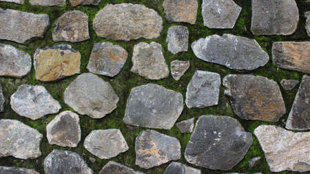 A mixture of stone and cement texture materials as a background or part of the building foundation.の写真素材