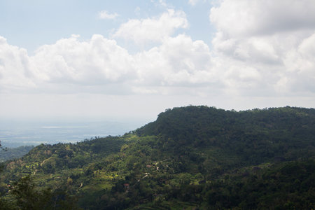 collection of clouds in blue sky in summer with tropical forest hills view.