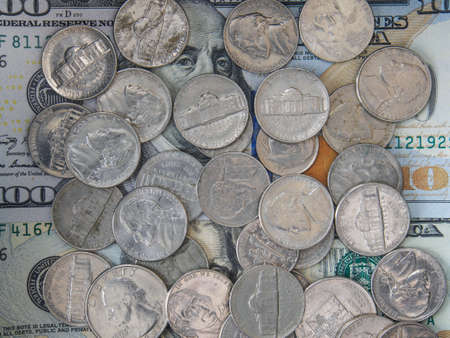 US coins on US dollar banknotes