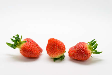 Fresh strawberries isolated on white backgroundの写真素材