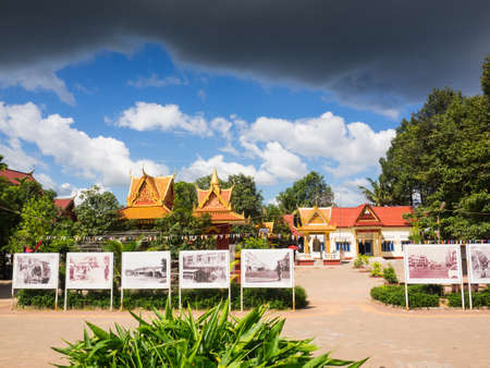 Siem Reap, Cambodia - October 31, 2016: Wat Thmey or Thmey Temple, one of killing field sites in Cambodia displaying the old photographs of civil war in Cambodia while the dark cloud floating above the blue sky.のeditorial素材