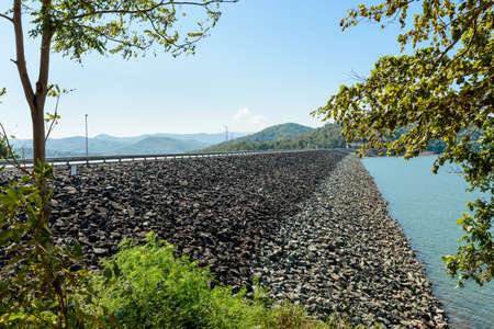 The rock wall of  Queen Sirikit Dam in Uttaradit Province, Thailand, in perspective viewの写真素材
