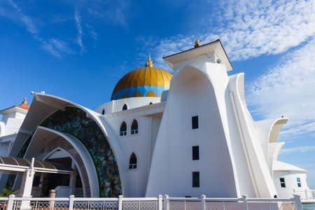 Melaka floating mosque or Masjid Selat Melaka in Melaka or Malacca, Malaysia, with blue skyの写真素材