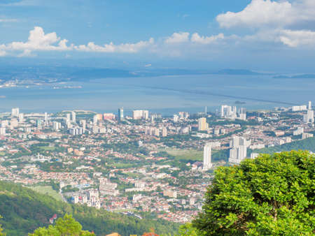 The scenery from Penang Hill, Penang, Malaysia, showing the city in the foreground and the sea and Penang bridge in the background.の写真素材
