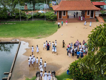 Anuradhapura, Sri Lanka - November 10, 2017: Sri Lankan students and Western tourists visiting Isurumuniya, the ancient temple which was built between 250 - 210 BC.のeditorial素材