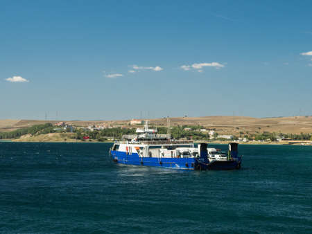 Canakkale, Turkey - October 05, 2018: The  ferry with trucks, cars and passengers on board crossing Dardanelles Strait in Canakkale, Turkey.のeditorial素材