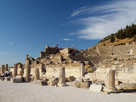 Ephesus, Turkey - October 06, 2018: Tourists climbing up the ruins of the ancient city of Ephesus,...