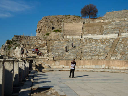 Ephesus Turkey - October 06, 2018: The unidentified couples hugging each other on the floor of the ruins of the Great Theatre at the ancient city of Ephesus,  Izmir Province, Turkey.のeditorial素材