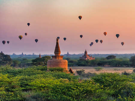 Bagan, Myanmar - February 03, 2019: Hot air balloons flying over the pagodas in Bagan in the early morning.のeditorial素材