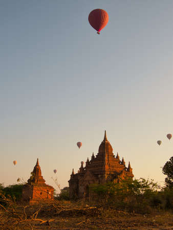 Bagan, Myanmar - February 03, 2019: Hot air balloons flying over the pagodas in Bagan in the...