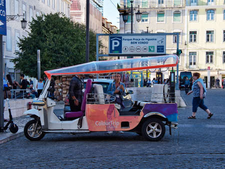 Lisbon, Portugal - October 01, 2019:  Tuk Tuk waiting for tourists or passengers at the Figueira Plaza, in Lisbon, Portugalのeditorial素材
