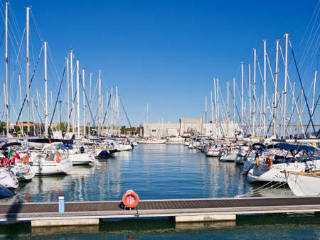 Lisbon, Portugal - October 01, 2019:  The scenery of various yachts docking in a row at marina near the Belem Monument of Discoveries in Lisbon, Portugal.のeditorial素材