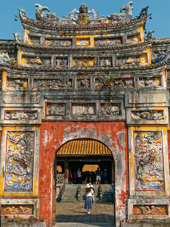Hue, Vietnam - March 22, 2023: Close up of the Mieu Gate entrance with the Chinese character means the name of the gate, within the Imperial Citadel or the Imperial city which is a travel destination.のeditorial素材