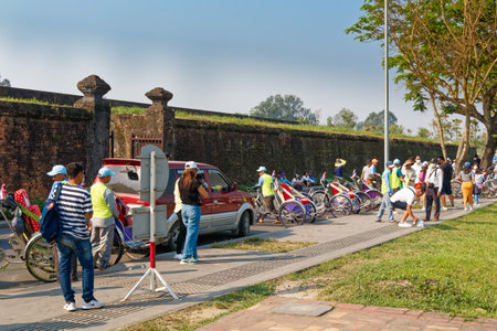 Hue, Vietnam - March 22, 2023:  A group of Thai tourists have just arrived at the Imperial Citadel...