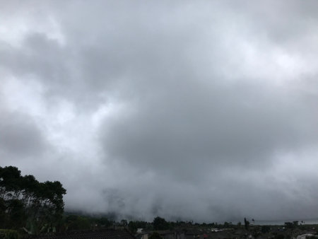 Clouds in the sky over the village. Cloudy weather.