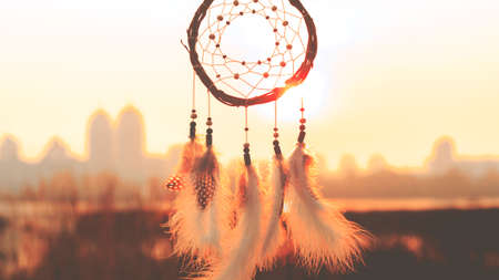 Dream catcher against the sky. City across the river. Far from the bustle of the city. Horizontal photography.の写真素材