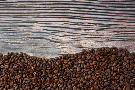 Freshly roasted coffee beans background. Coffee background.
