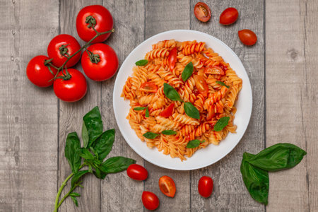 Italian pasta on plate on grey wooden background. Tasty meal.の写真素材