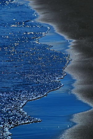 line of surf on a sandy beachの写真素材