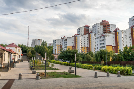 The pedestrian street in Belgorod, western Russia, with the cloudy sky, buildings and trees, Belgorod oblast.の写真素材