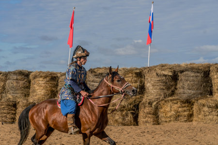 The archer on the horse at the traditional Kazakh archery sport competition, during World Nomad Games.の写真素材