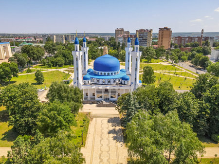 The beautiful mosque in Maykop, Adygea Republic at North Caucasus, Russia, with the green park, and minarets during the summer day.の写真素材