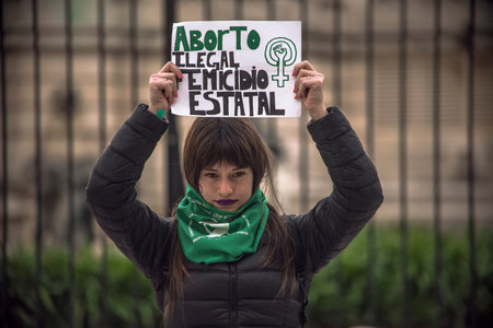 Photo of political activist woman for legal abortion in the congress from 2018. Green handkerchief. Buenos Aires, Argentinaのeditorial素材