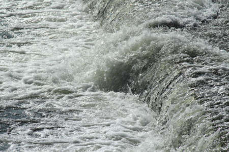 River Floweing Over a Weir - River Taff, Cardiff, Walesの写真素材