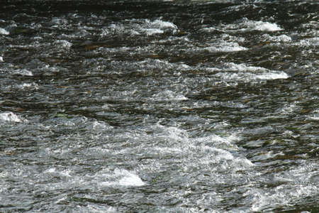 River Flowing over Stones  - River Taff, Cardiff, Walesの写真素材
