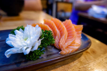 Fresh Salmon Sashimi. Raw salmon decoration with flowerの写真素材