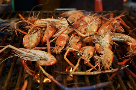 Grilled shrimp on steel grille.の写真素材