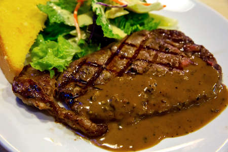 Australia Strip Loin Meat with vegetable saladの写真素材