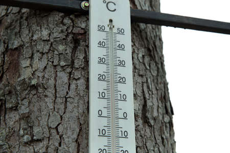 Thermometer displaying high 24 degree comfortable temperatures in summer day.の写真素材